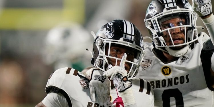 Western Michigan cornerback Keni-H Lovely (18) and cornerback DaShon Bussell (0)